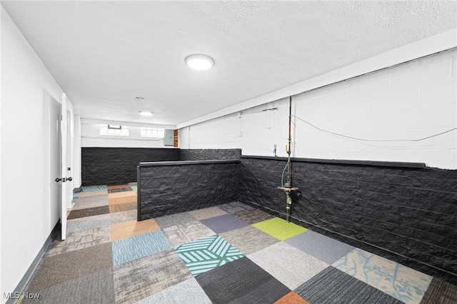 interior details featuring a textured ceiling