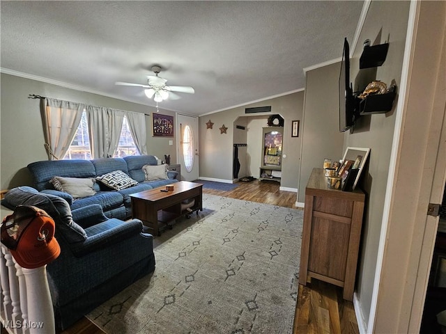 living room with ceiling fan, hardwood / wood-style floors, and ornamental molding