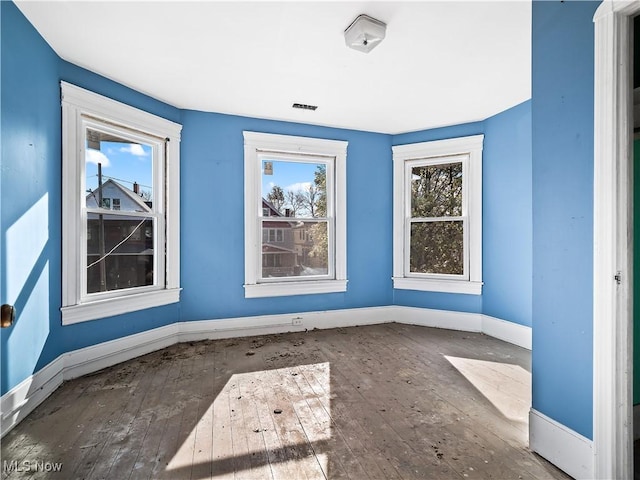 6114 W Clinton Ave, Cleveland, OH 44102 - empty room with hardwood / wood-style flooring and baseboards