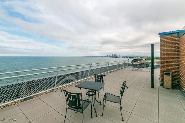 view of patio / terrace with a water view