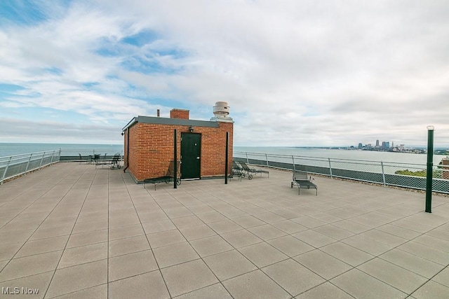 view of patio / terrace featuring a water view