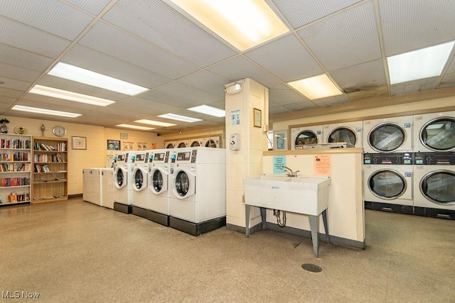 laundry room with washing machine and clothes dryer and stacked washer and dryer