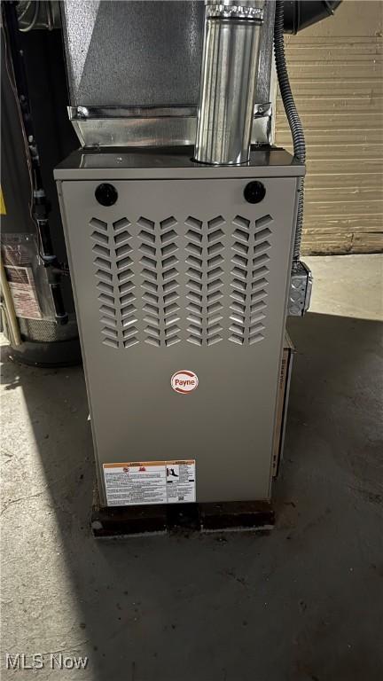 utility room featuring heating unit