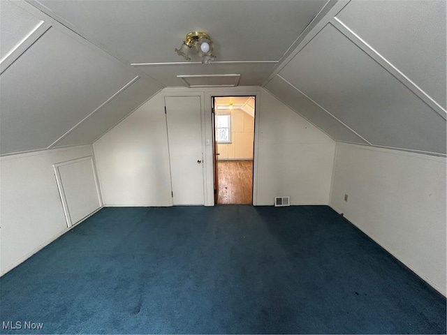 bonus room with vaulted ceiling