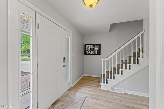 entrance foyer with light hardwood / wood-style flooring