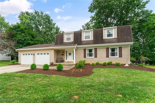 view of front of home featuring a front yard and a garage