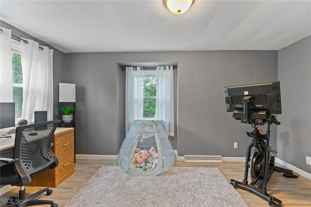 office space with light hardwood / wood-style floors