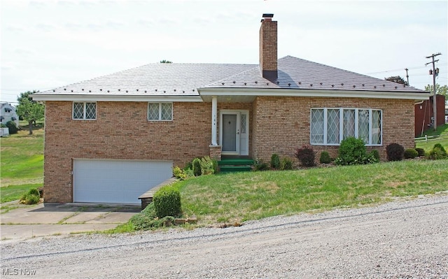 exterior space featuring a front yard and a garage