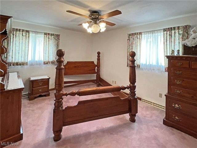 bedroom featuring ceiling fan, light colored carpet, and a baseboard radiator