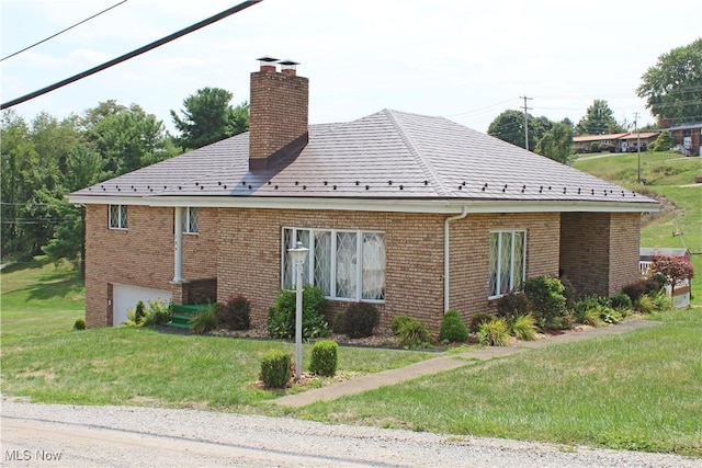 view of property exterior featuring a lawn and a garage