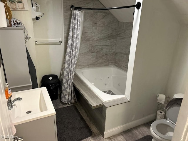 full bathroom with shower / bath combo with shower curtain, vanity, and toilet