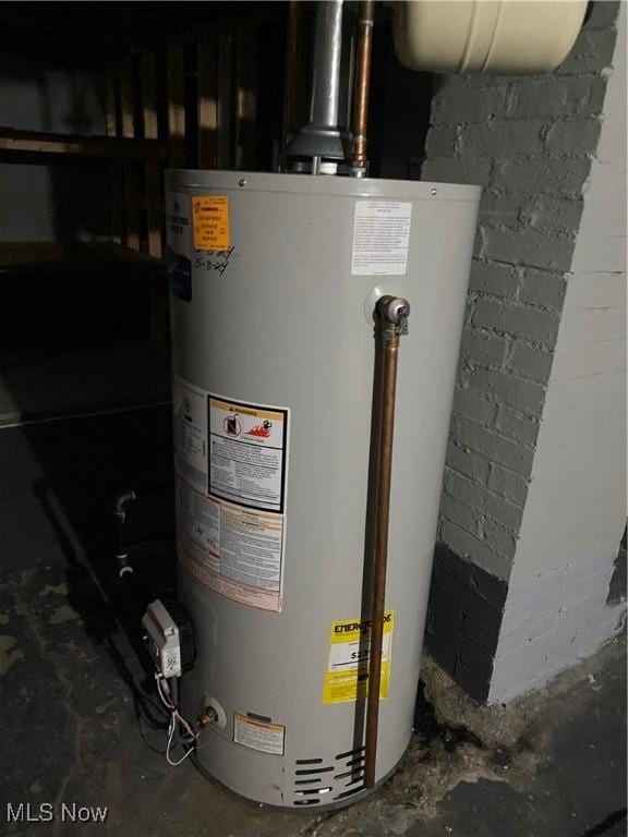 utility room featuring water heater