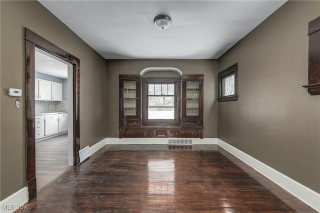 interior space featuring dark wood-type flooring