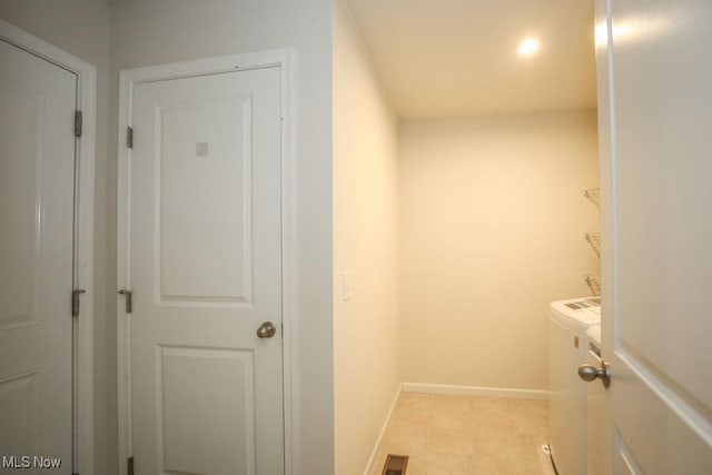 laundry area with washing machine and clothes dryer