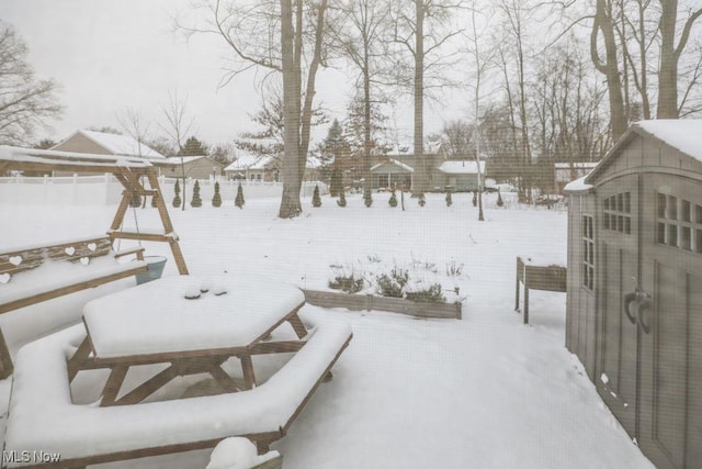 view of yard covered in snow