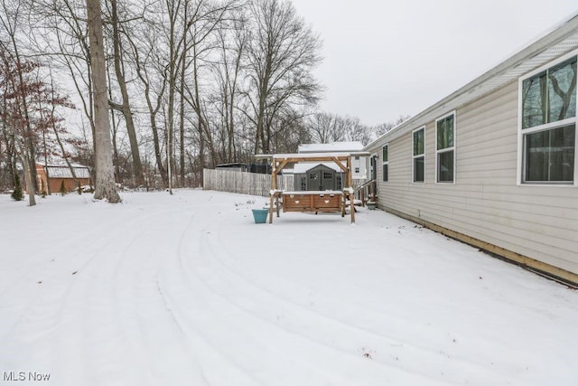 view of yard covered in snow