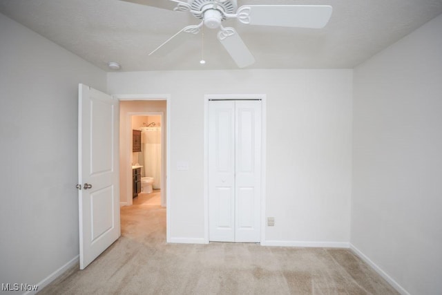 unfurnished bedroom with light carpet, a closet, and ceiling fan