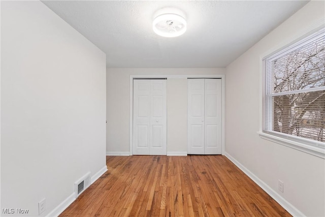 unfurnished bedroom featuring light hardwood / wood-style floors