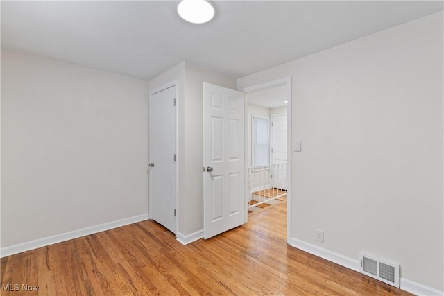 unfurnished room featuring light wood-type flooring