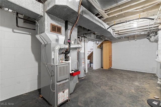 basement featuring gas water heater and heating unit