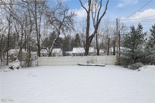 view of yard layered in snow