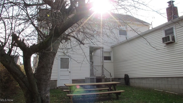 back of house featuring central AC unit and cooling unit