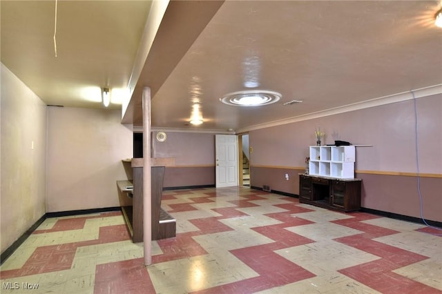 basement featuring crown molding