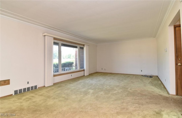 carpeted spare room with ornamental molding