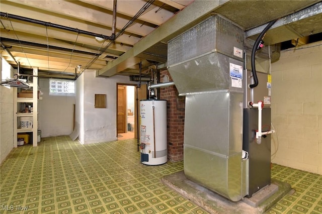 basement featuring gas water heater and heating unit