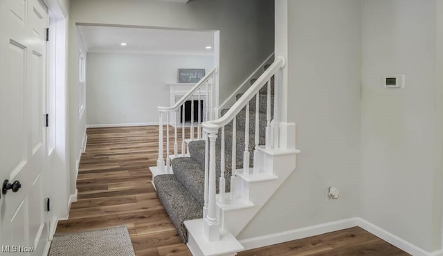 stairway with wood-type flooring