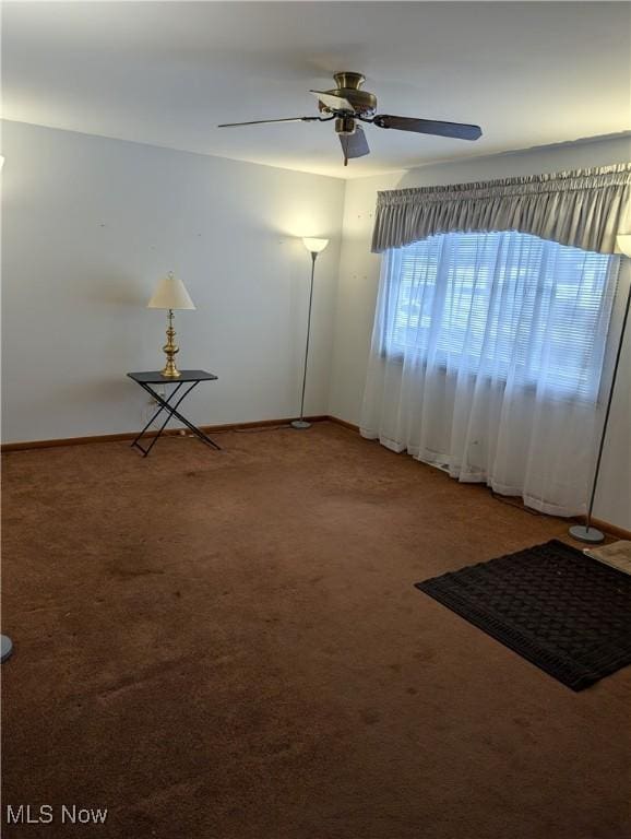 empty room with carpet and ceiling fan