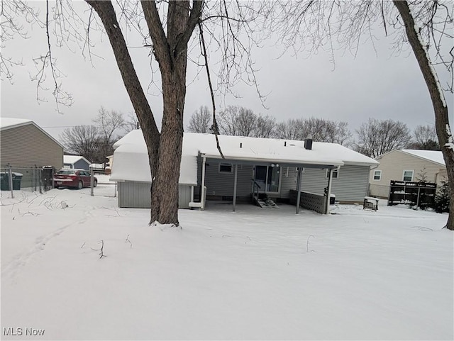 view of snow covered house