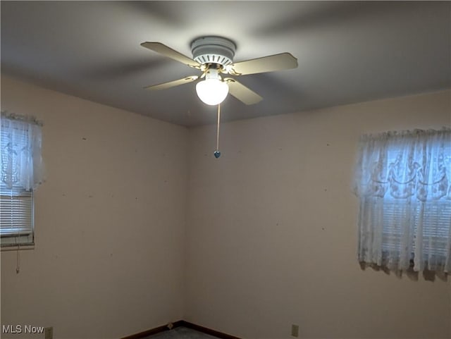 spare room with ceiling fan