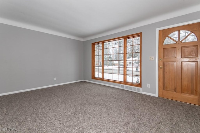 view of carpeted entrance foyer