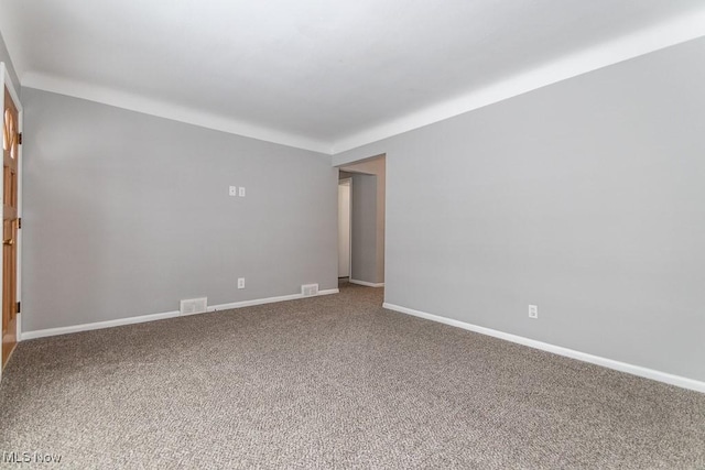 unfurnished room featuring carpet flooring