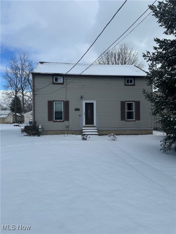 view of snow covered property