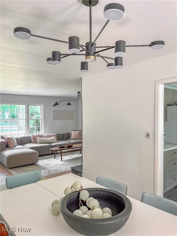 interior space with a chandelier and wood-type flooring