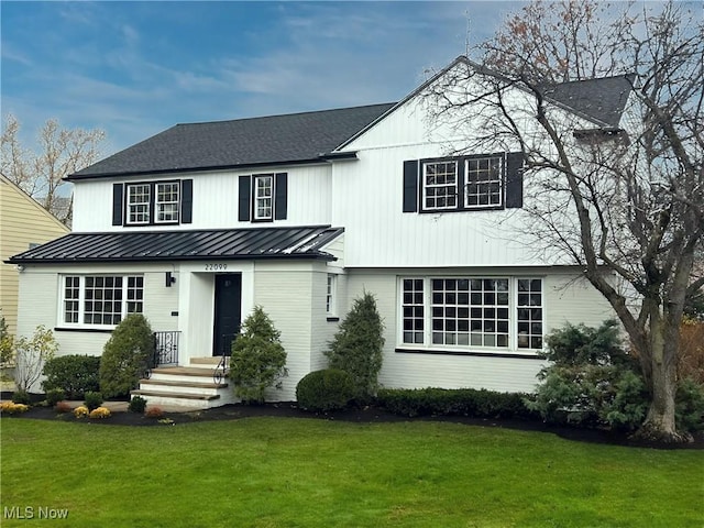 view of front of property with a front lawn