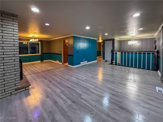 unfurnished living room featuring hardwood / wood-style floors