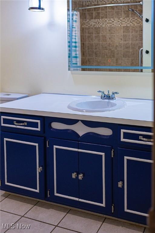 bathroom featuring tile patterned floors and vanity