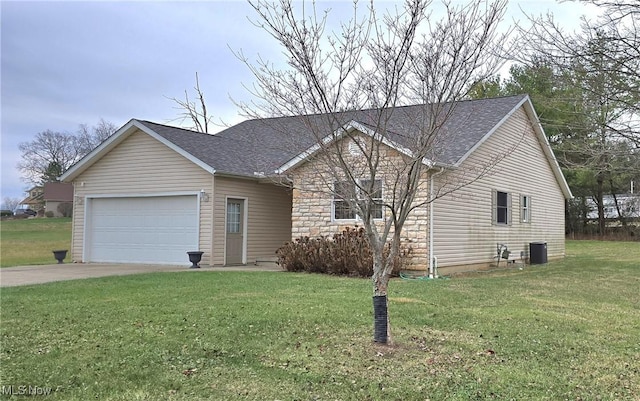 view of front of house featuring a garage and a front lawn