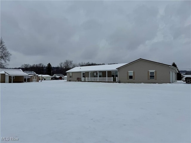 view of snow covered property