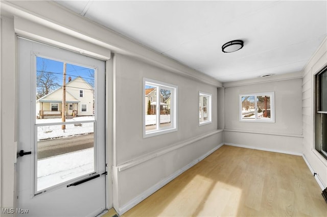 interior space with light hardwood / wood-style floors and plenty of natural light