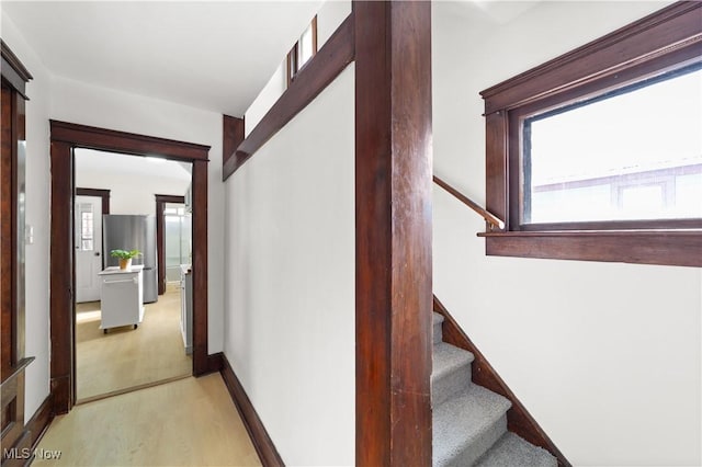 corridor featuring light hardwood / wood-style floors