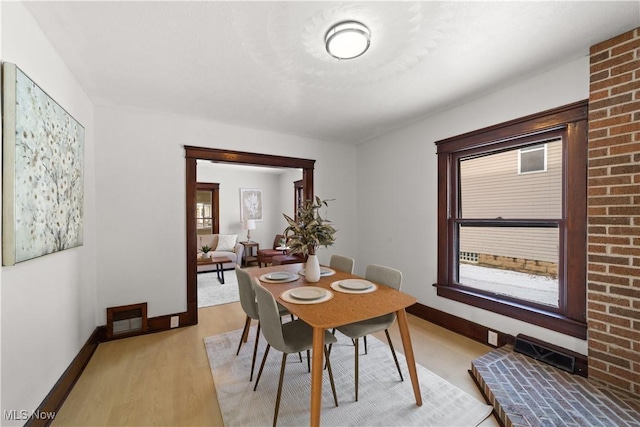 dining room with light hardwood / wood-style flooring