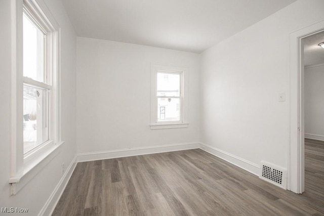 unfurnished room featuring wood-type flooring