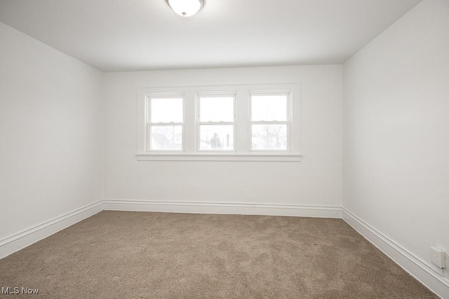 unfurnished room with carpet floors