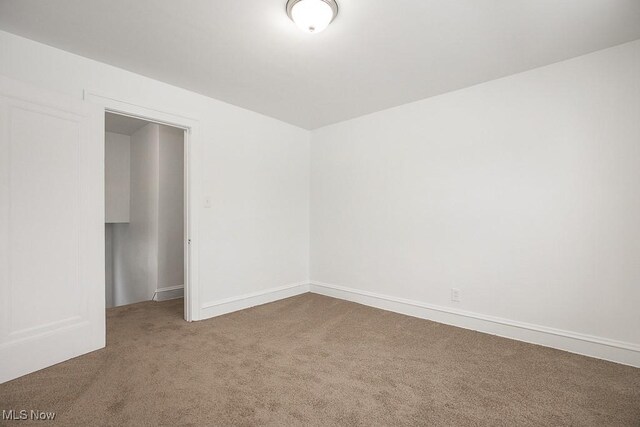 unfurnished room with carpet