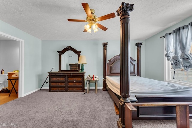 carpeted bedroom with ceiling fan and a textured ceiling