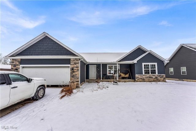 view of front of house featuring a porch and a garage